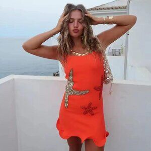 Bright orange sequin starfish sleeveless mini dress with wired ruffle hem | Sz S